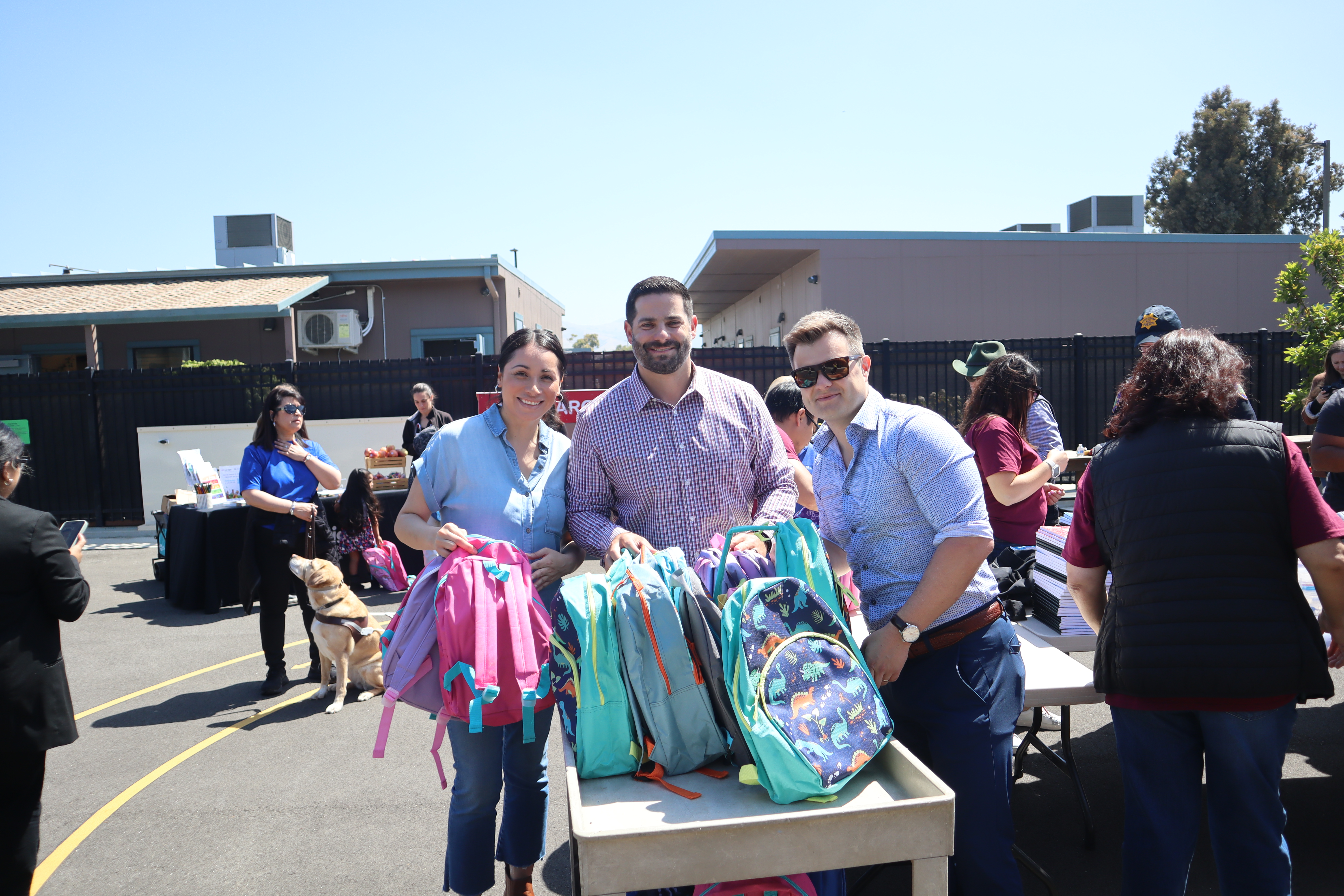 Three ELS members at the Stuff the Bus event