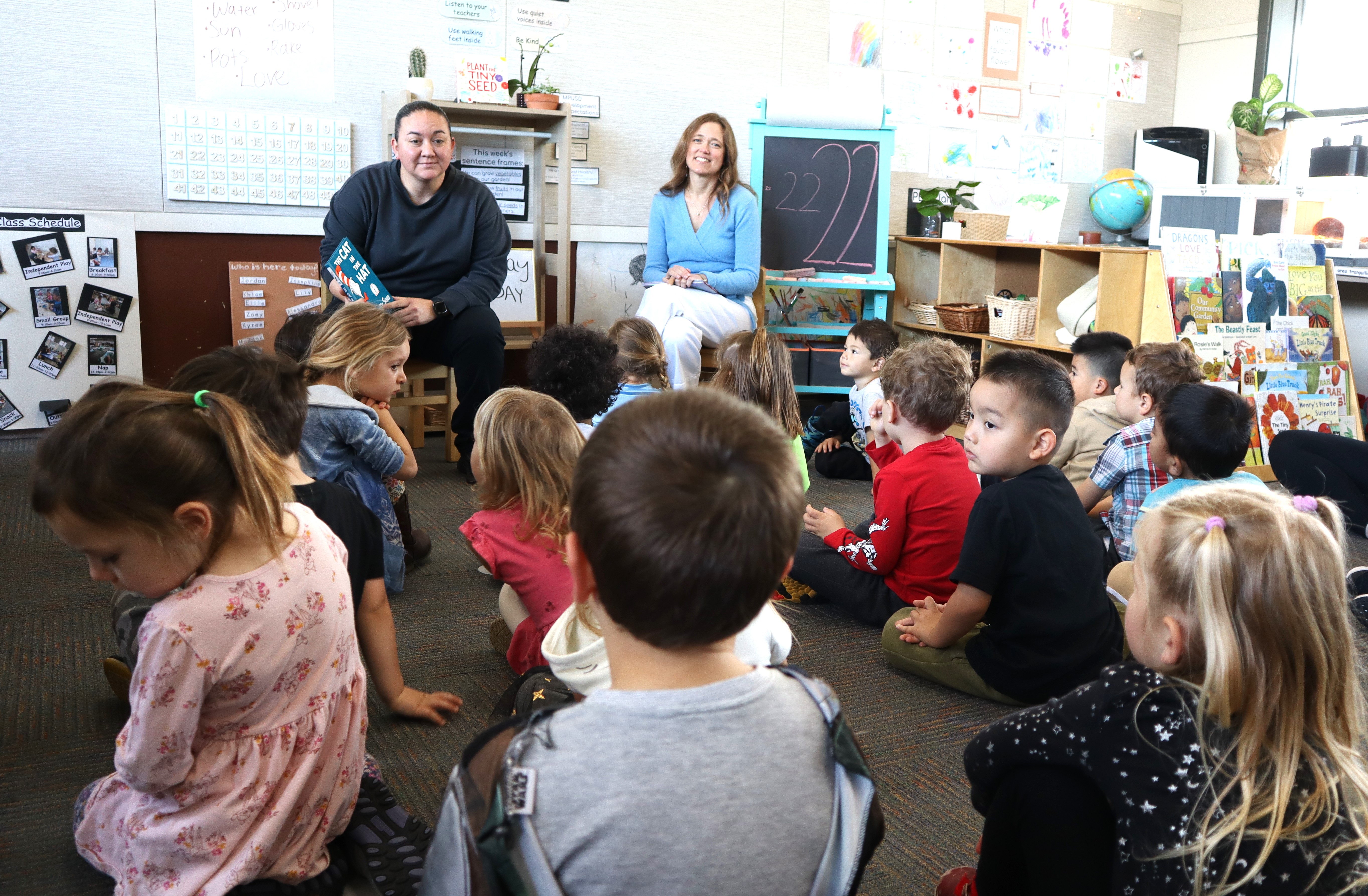 Volunteers reading to a class