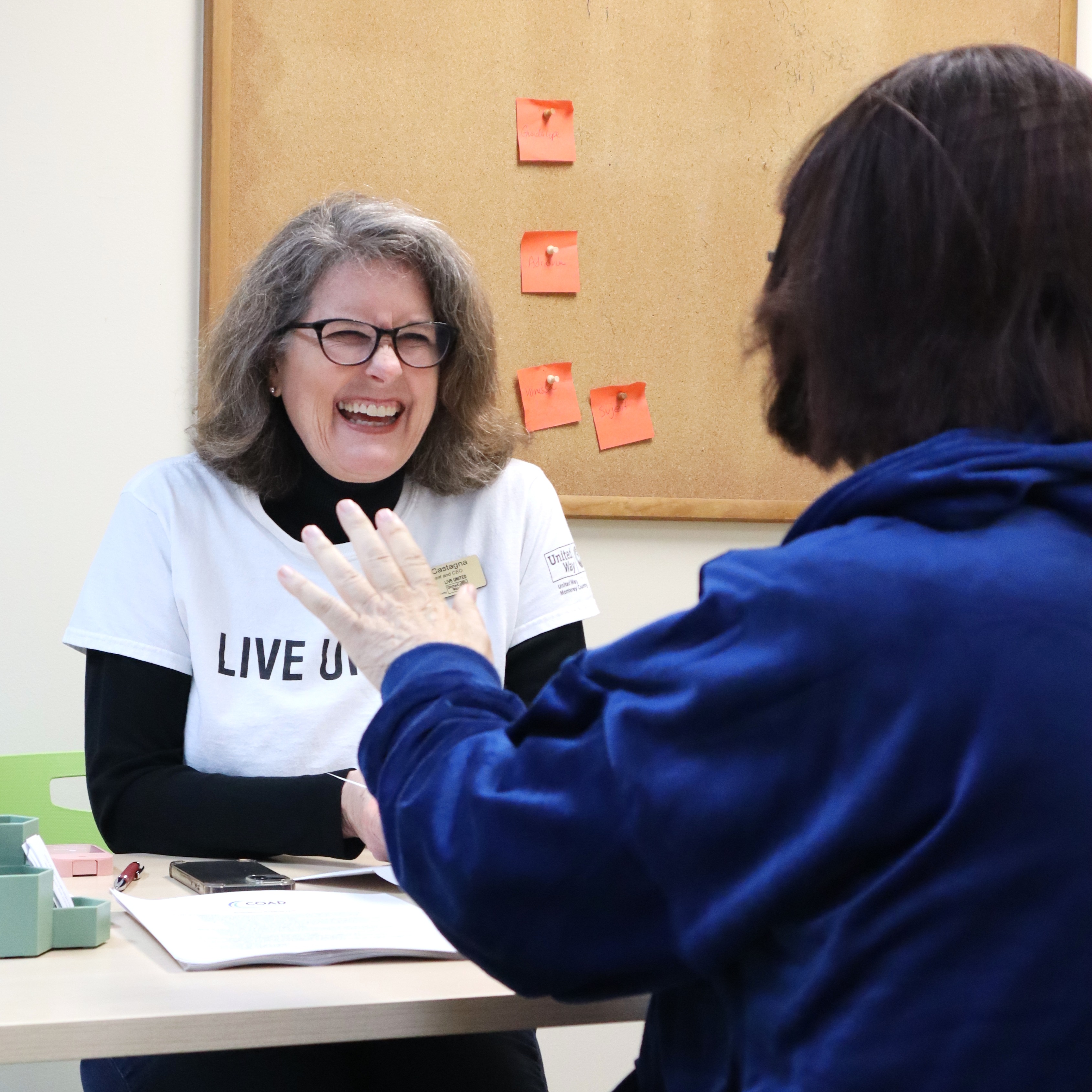 Person smiling in conversation