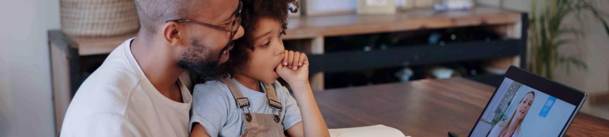 Parent and child on telehealth call
